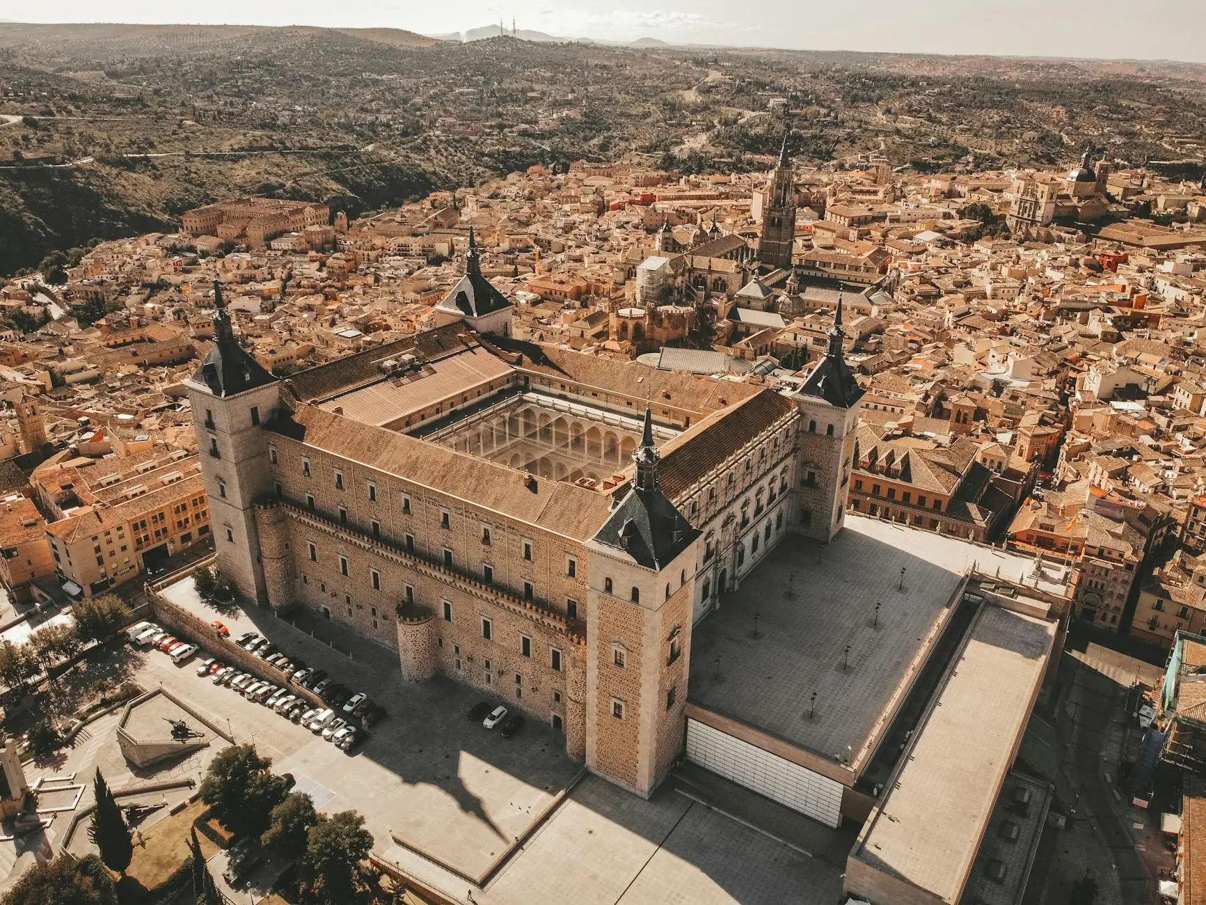 Stunning aerial view of Alcázar of Toledo, showcasing historic architecture and cityscape in Spain.