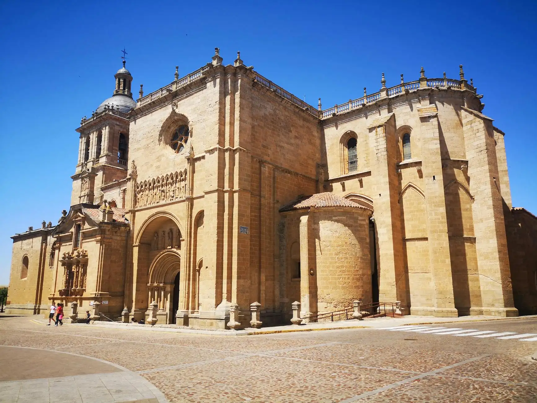 Capture of a historic Romanesque church on a sunny day with clear blue skies.