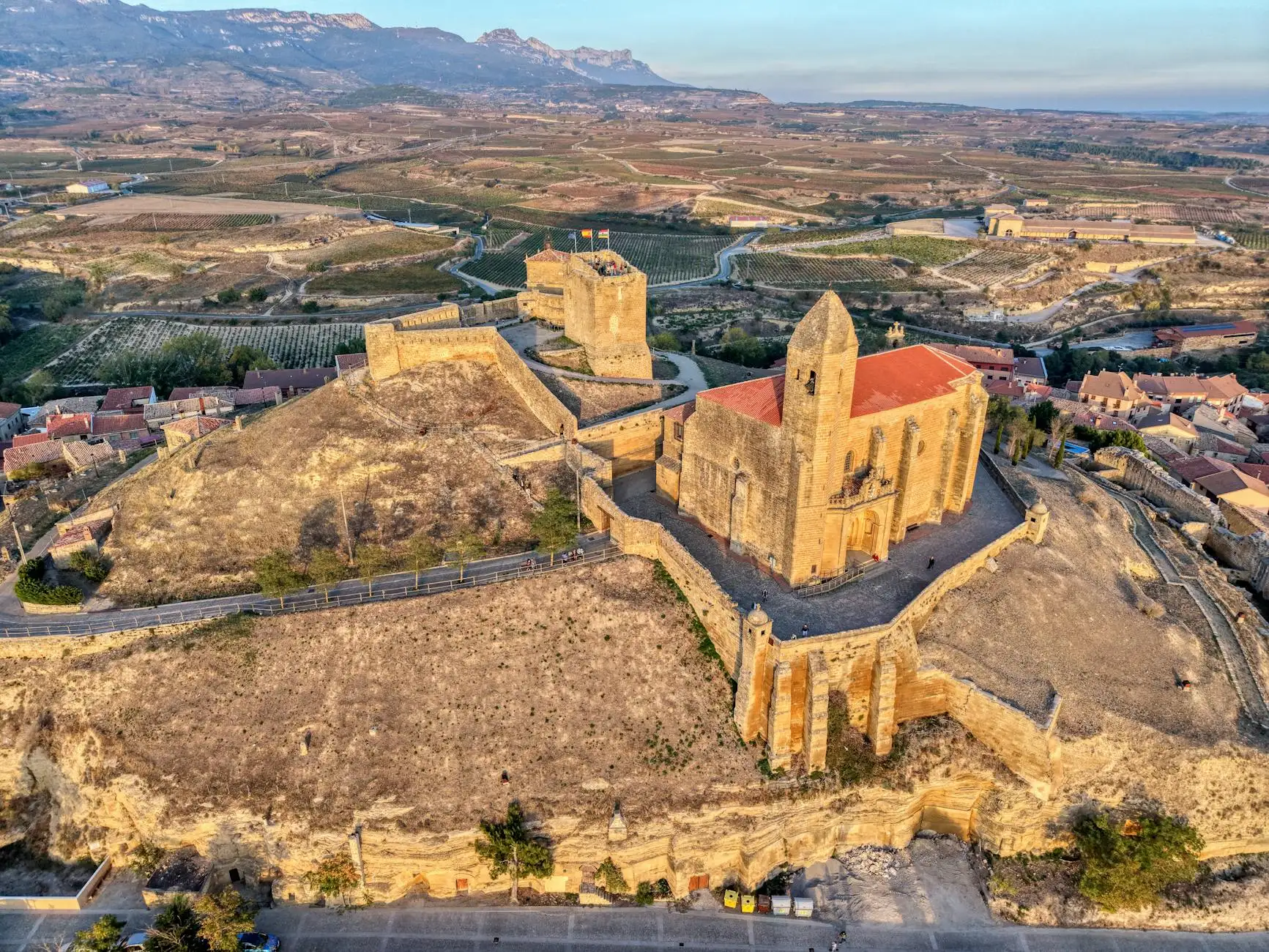 Stunning aerial view of historic castle in La Rioja, Spain at sunrise.